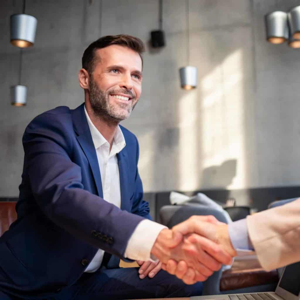 Business people shaking hands during meeting